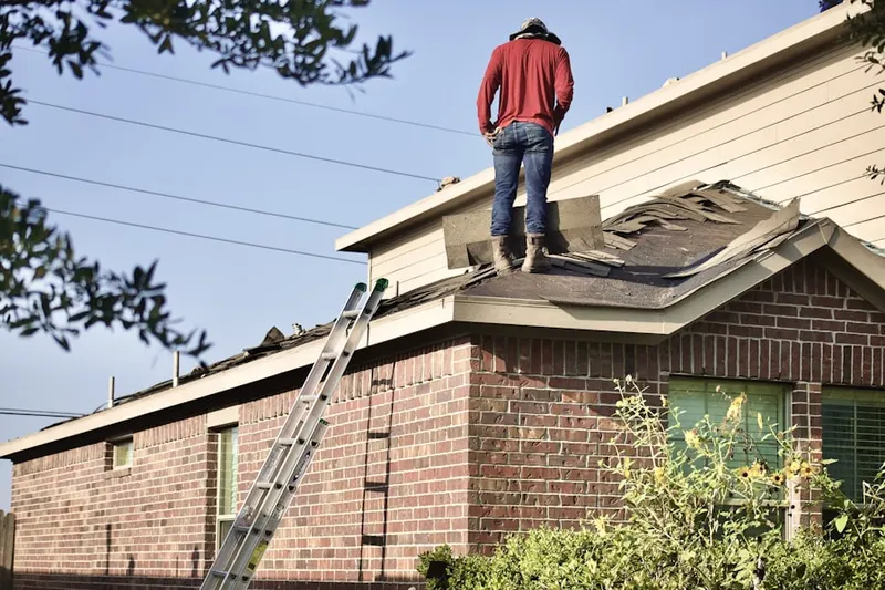 Professional roofer working on a residential roof in Rancho Conejo